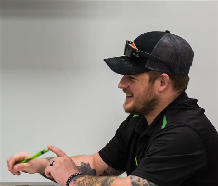 SERVPRO employee smiling at table