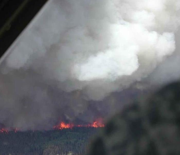 With fire, the inevitable must be tackled- smoke. This is seen through the window in this image. 