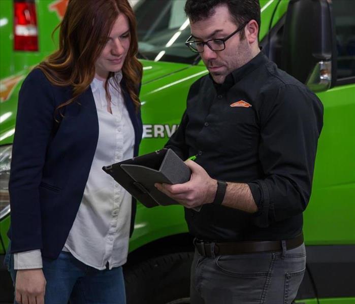 SERVPRO technician and client