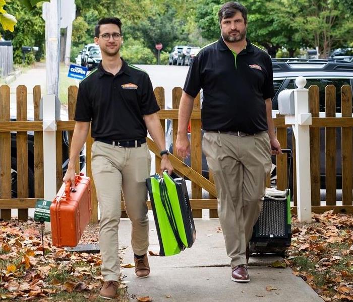 Two SERVPRO workers arriving at clients home fully equipped 