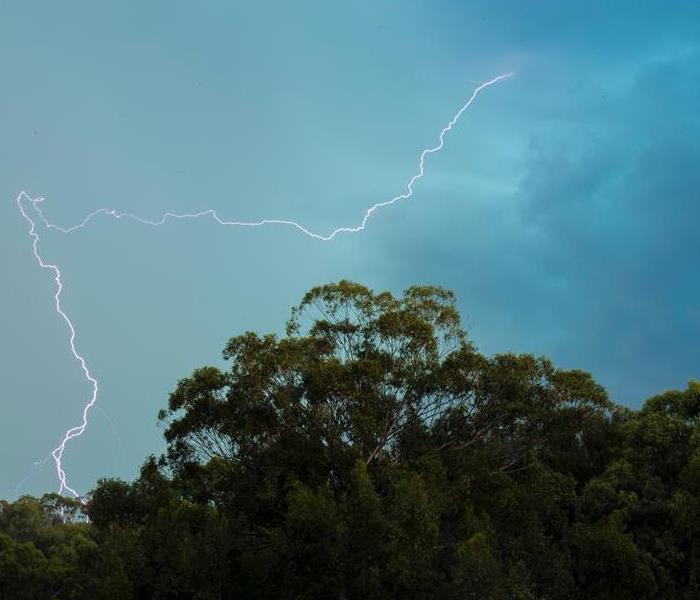 Lightning strikes, displaying the unfavorable weather- make sure you know what to do when a storm happens!