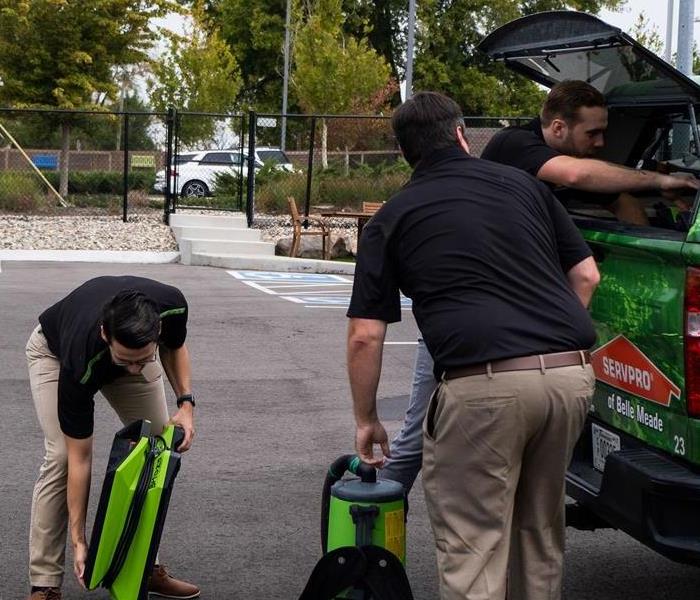 SERVPRO Restoration team loading up their truck with supplies for mold remediation 